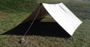 Private's tent, a sheet of canvas over a raised rod, open on both ends