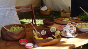Photo of camp food, in wooden bowls or old-fashioned ceramics