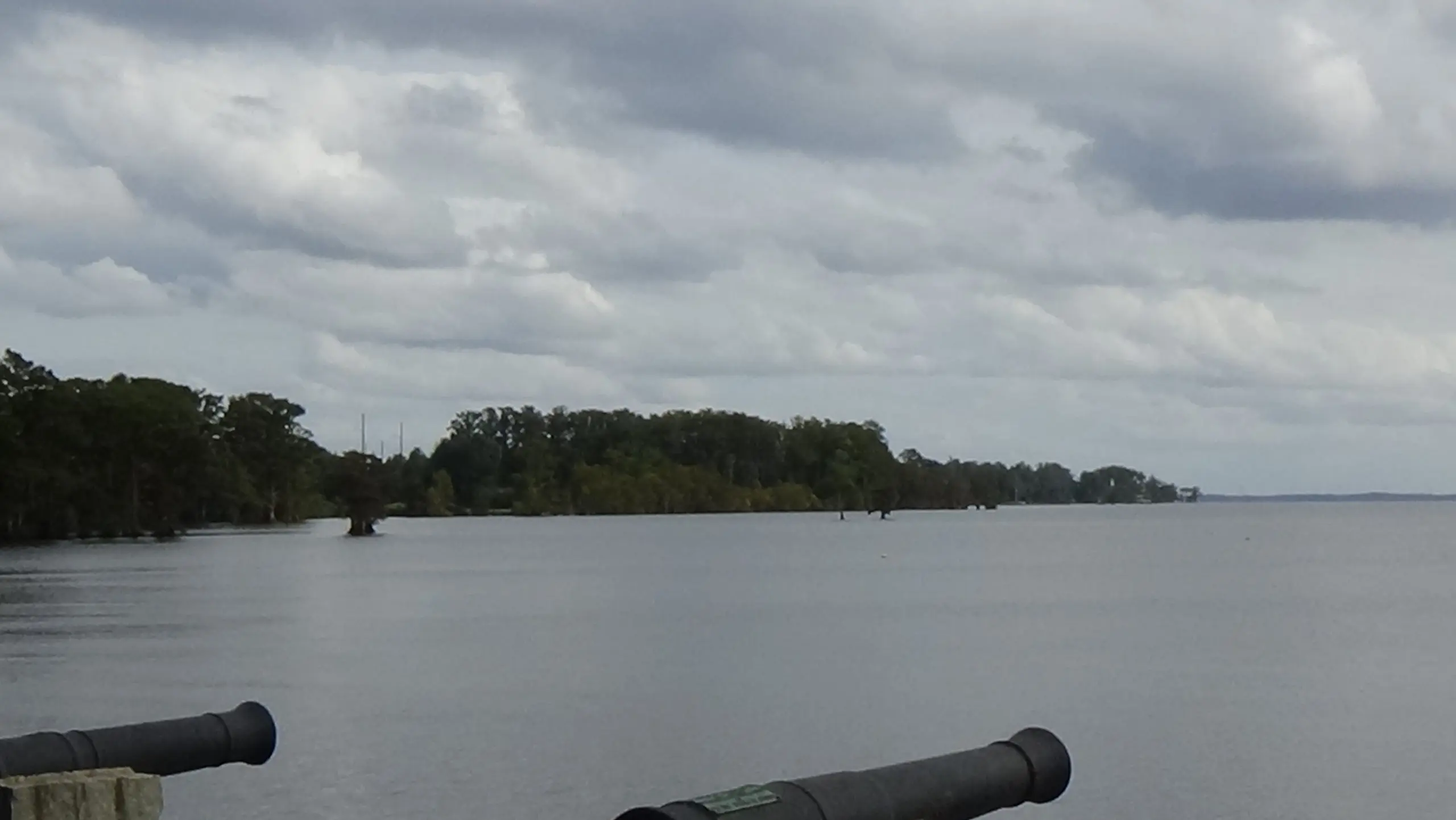 Photo of open water with cannons at bottom of picture