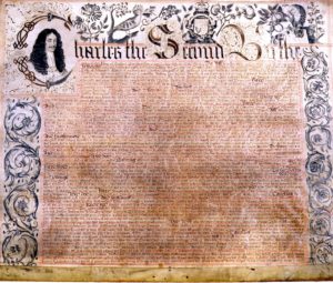 Photo of an decorated old document with a portrait of King Charles in the upper left corner