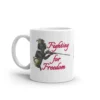 Mug with a man in 1700s clothing firing a musket, and the phrase "Fighting for Freedom"