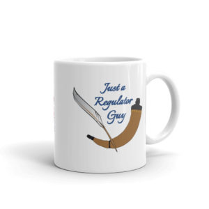 White mug with a quill and powder horn and the words, "Just a Regulator Guy."